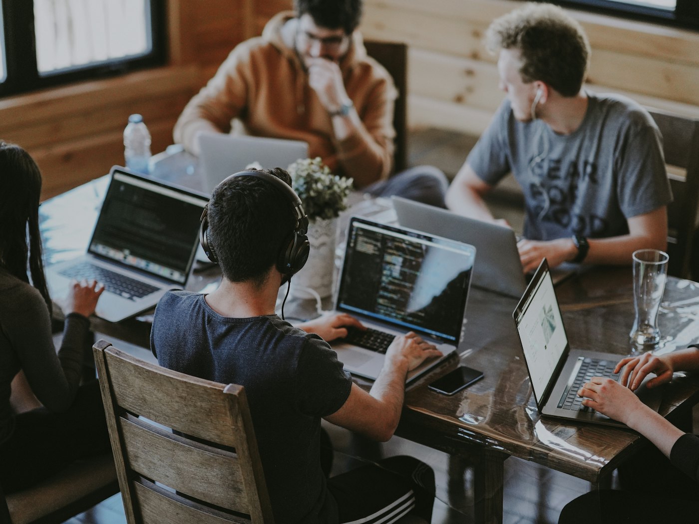 A team building a client system around one table